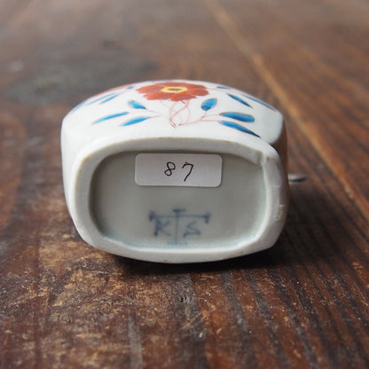 87　色絵ケシ文扁壷 | 志村和晃